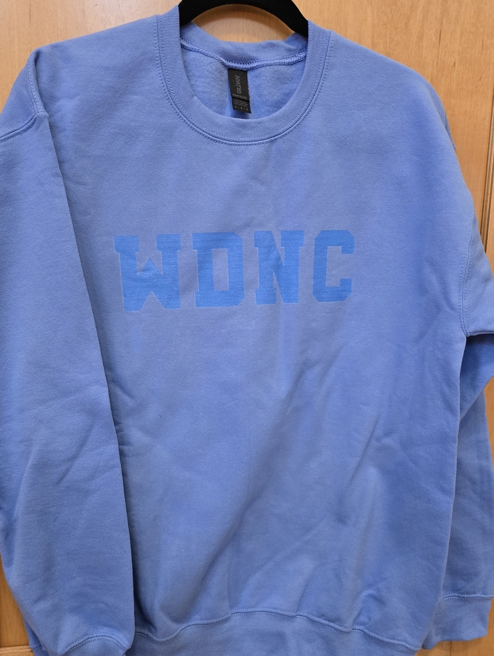 WDNC "We Do Not Care" Gildan Carolina Blue Crewneck Sweatshirt